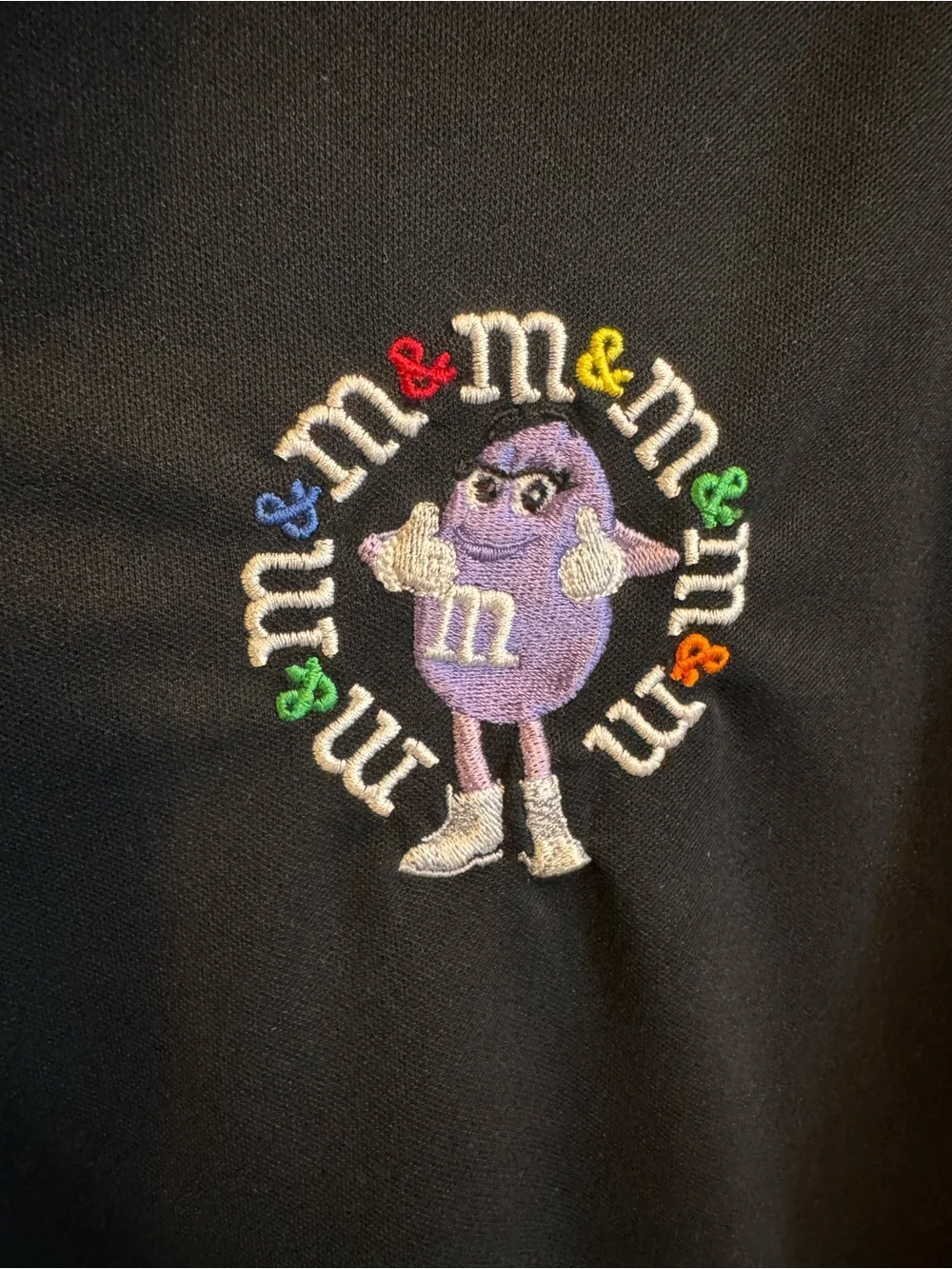 Nike Black Short-Sleeve Polo with Embroidered Purple M&M Character